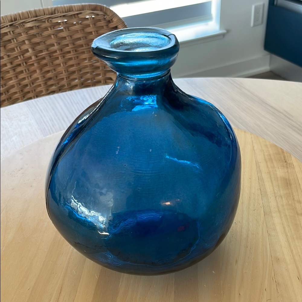 Beautiful blue glass vase for flowers or just on it’s own.